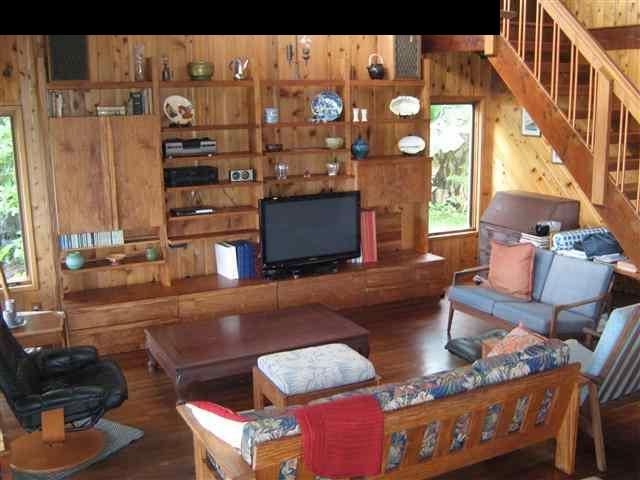 180 Ulaino Road Hana, HI 96713 - Photo 4 of 26 a living room with furniture and a floor to ceiling window