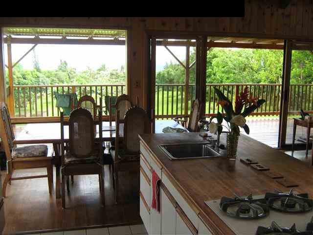 180 Ulaino Road Hana, HI 96713 - Photo 9 of 26 a kitchen with a large window and a sink