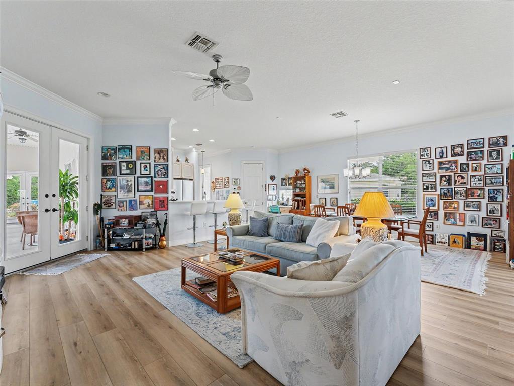 8910 Jericho Road Weeki Wachee, FL 34613 - Photo 19 of 52 a living room with furniture and wooden floor