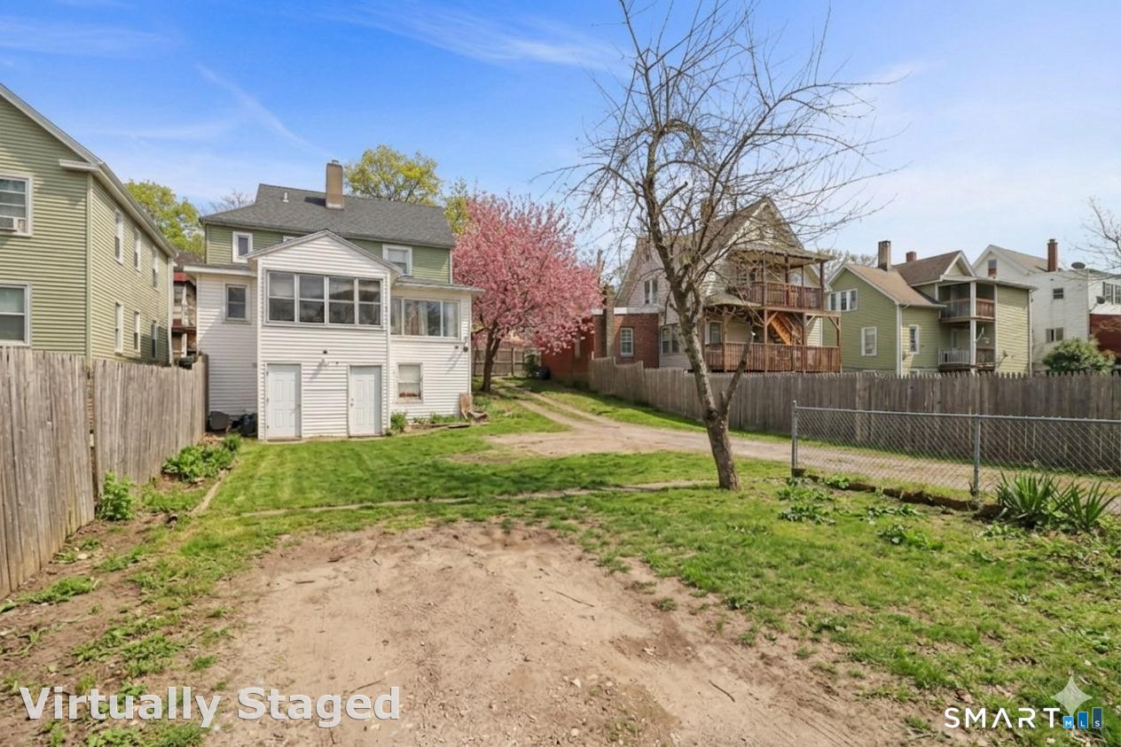 37 Manhan Street Waterbury, CT 06710 - Photo 14 of 19 a view of a house with a yard