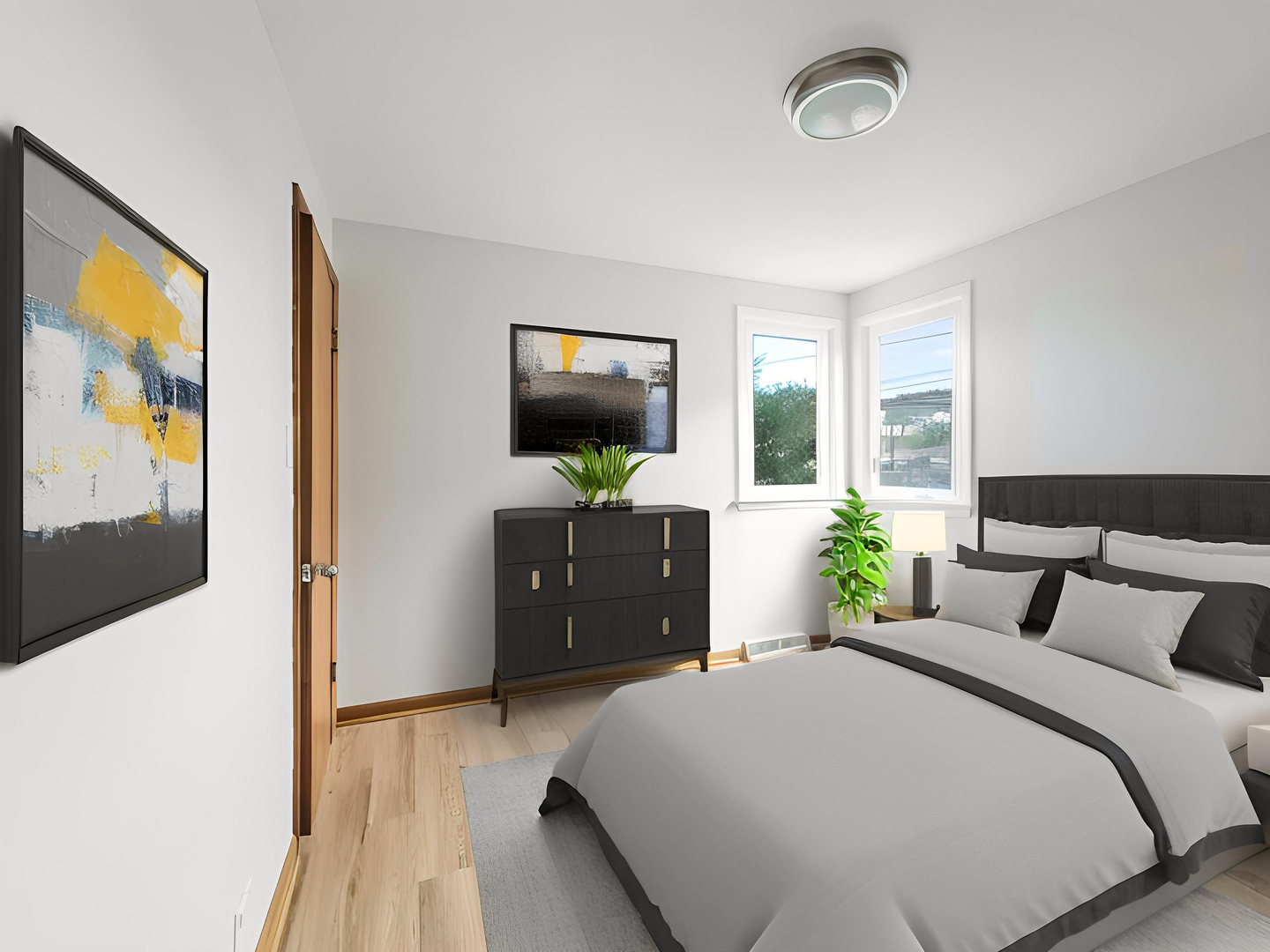 4313 Ruby Street Schiller Park, IL 60176 - Photo 11 of 25 a bedroom with a bed and a flat tv screen on dresser