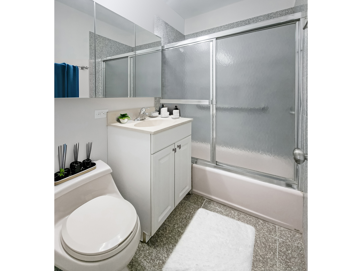 4313 Ruby Street Schiller Park, IL 60176 - Photo 17 of 25 a bathroom with a sink a toilet and shower