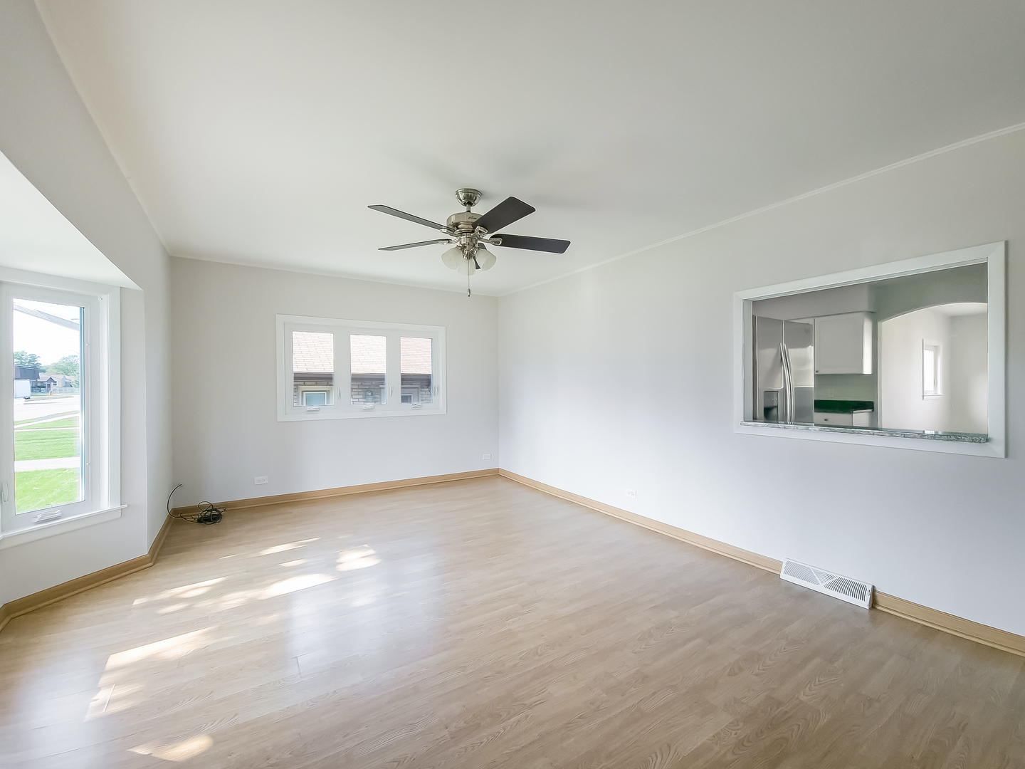 4313 Ruby Street Schiller Park, IL 60176 - Photo 2 of 25 a view of an empty room with a window
