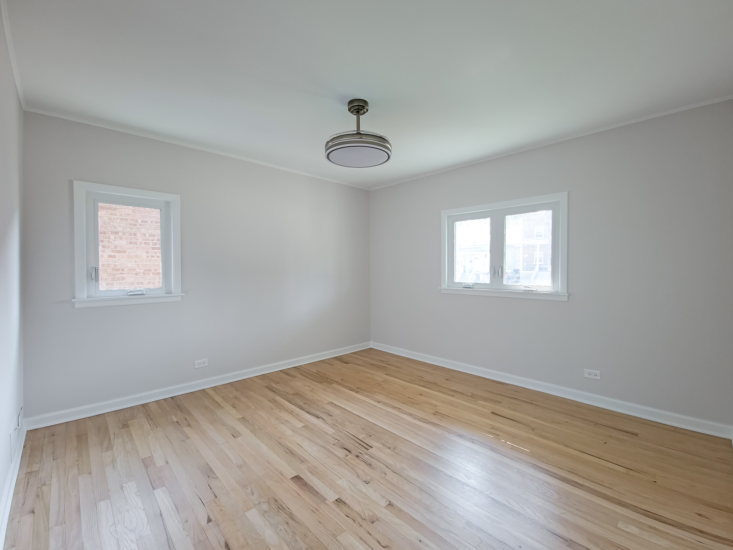 4313 Ruby Street Schiller Park, IL 60176 - Photo 6 of 25 a view of a room with wooden floor and windows