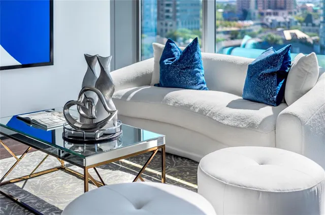 a living room with furniture and a table