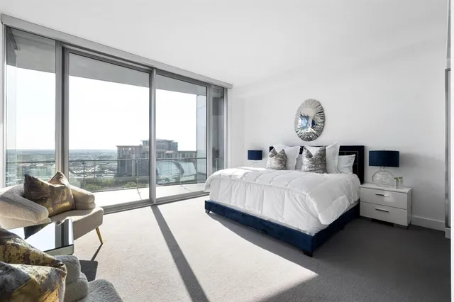 a en suite bathroom with a double vanity sink a mirror and a shower