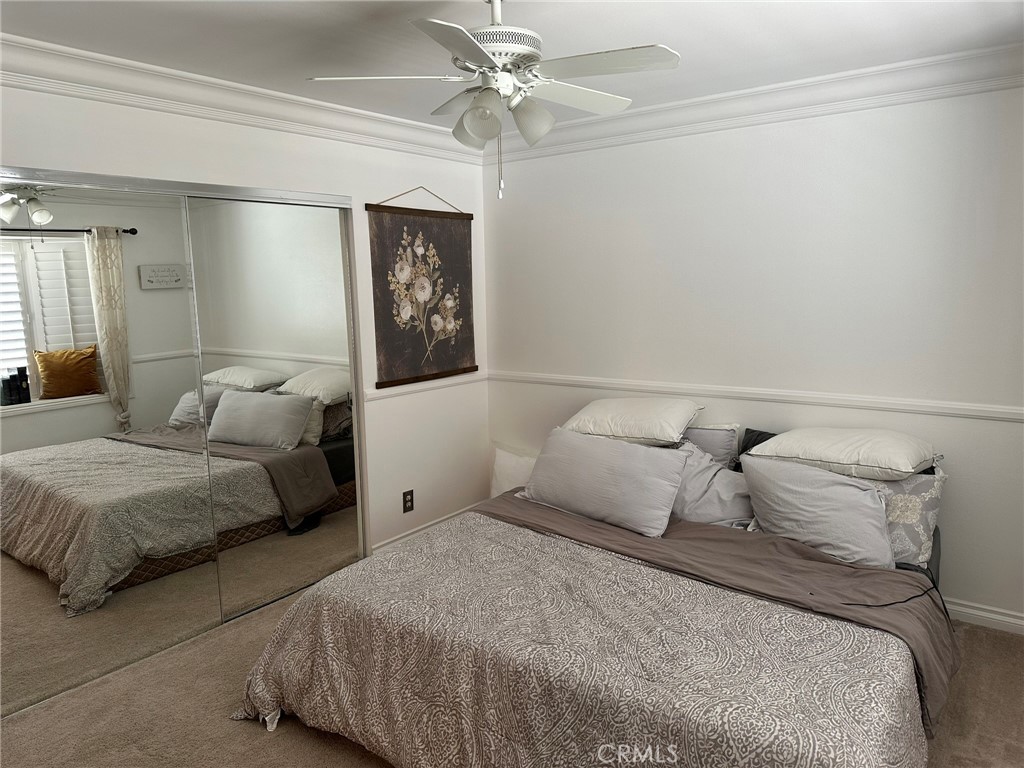 2752 Wanda Avenue Simi Valley, CA 93065 - Photo 18 of 40 a bedroom with a bed and a ceiling fan
