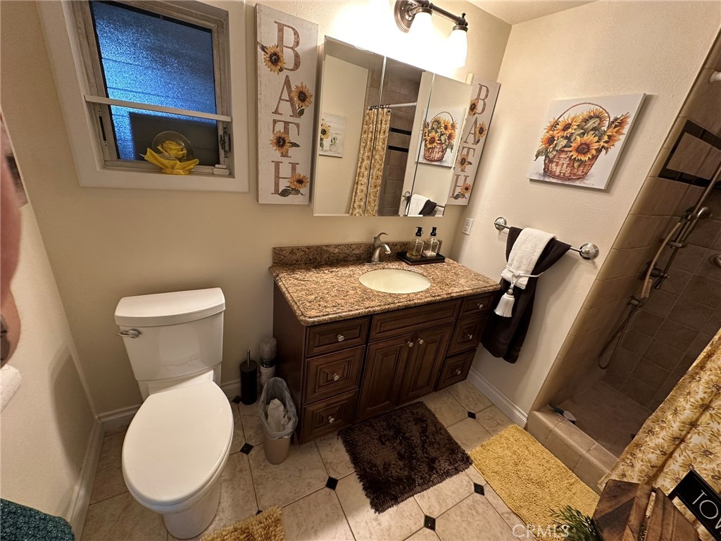 2752 Wanda Avenue Simi Valley, CA 93065 - Photo 20 of 40 a bathroom with a toilet sink and mirror