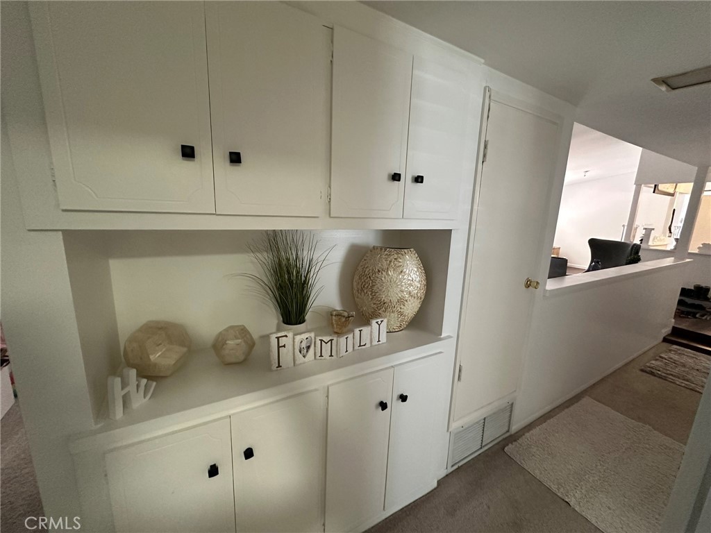 2752 Wanda Avenue Simi Valley, CA 93065 - Photo 22 of 40 a kitchen with white cabinets and potted plant