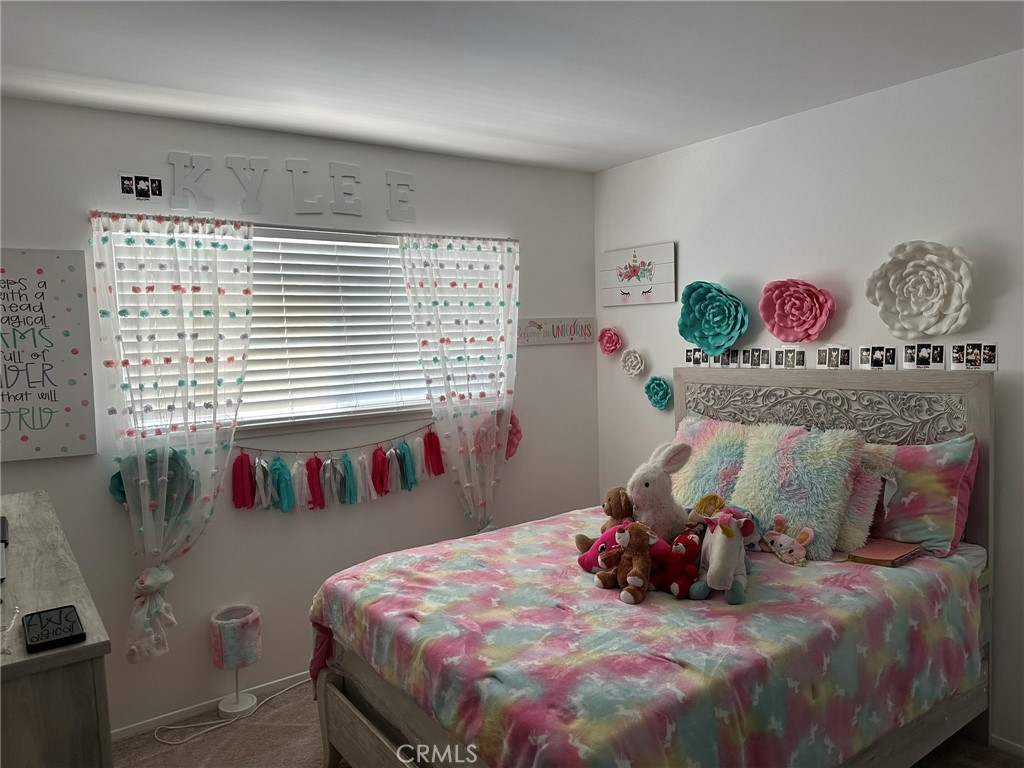 2752 Wanda Avenue Simi Valley, CA 93065 - Photo 24 of 40 a bedroom with bed and a window