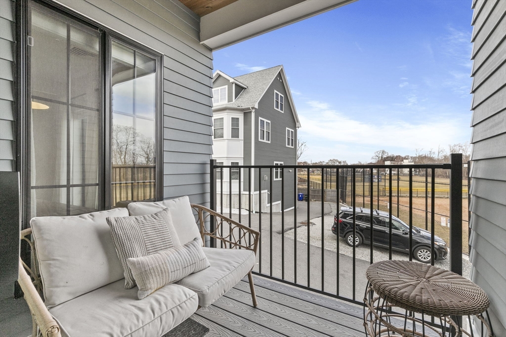 4 Payne Street, Unit ONE Boston, MA 02122 - Photo 16 of 18 a view of a balcony with furniture