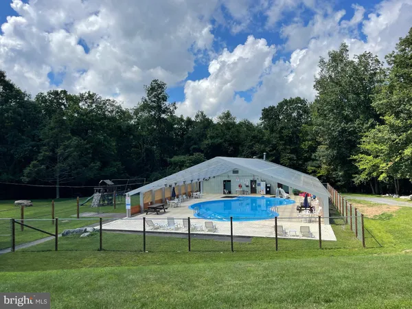 a view of a swimming pool with a balcony