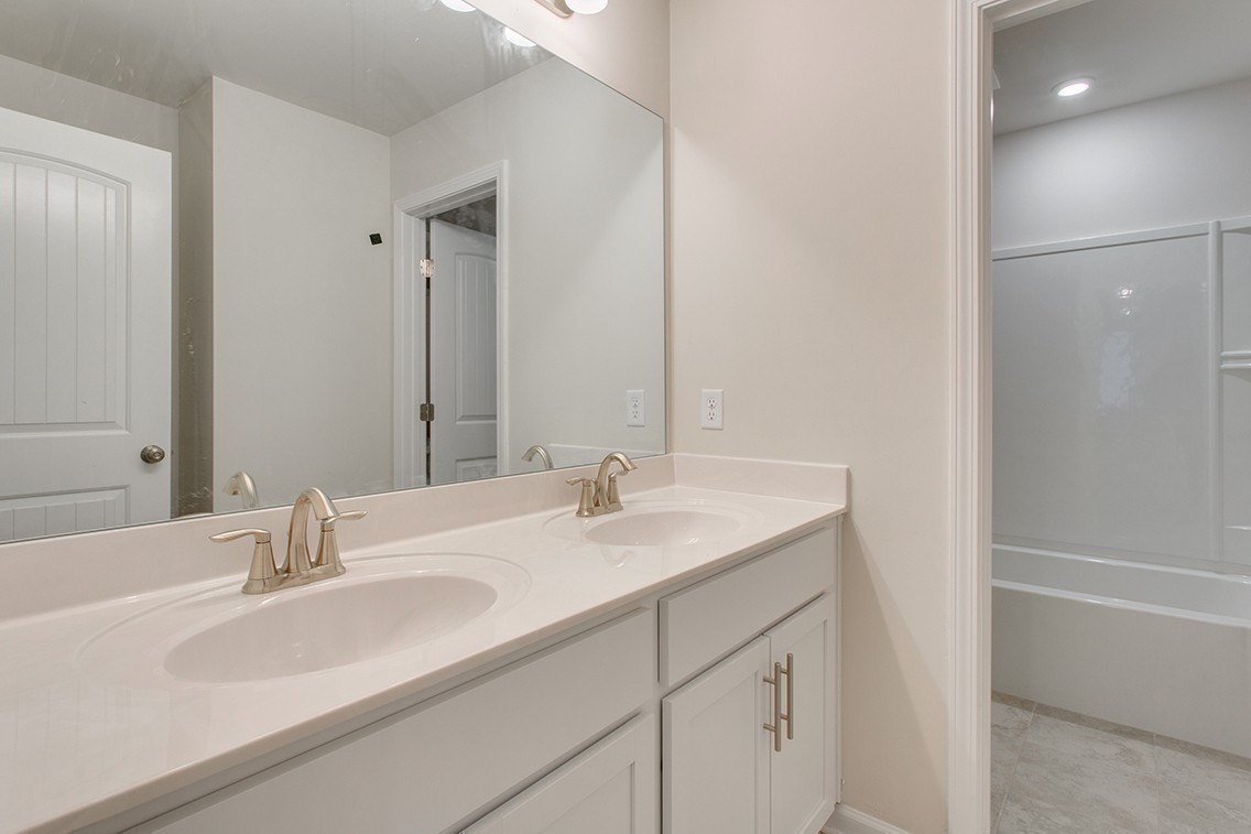 1310 Kristopher Drive Lebanon, TN 37087 - Photo 27 of 34 a bathroom with a sink and a mirror
