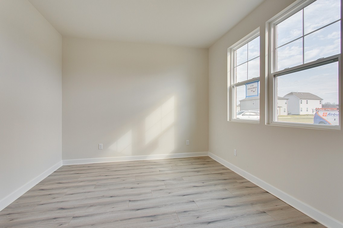 1310 Kristopher Drive Lebanon, TN 37087 - Photo 6 of 34 wooden floor in an empty room with a window