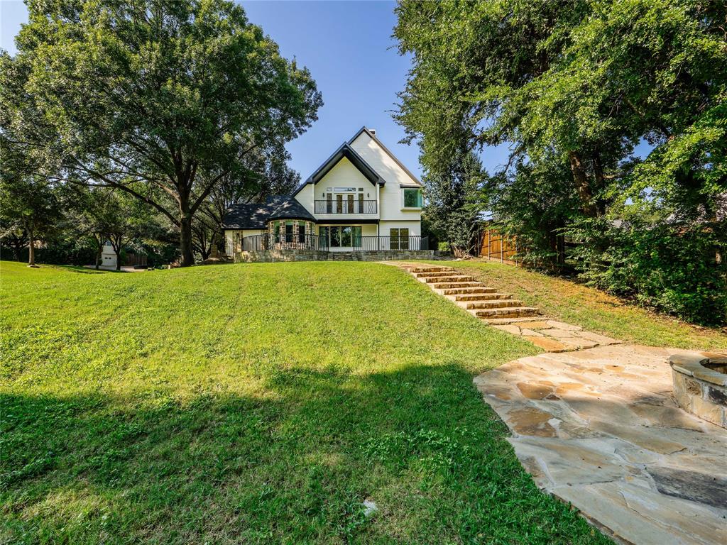 153 Meadowcreek Road Coppell, TX 75019 - Photo 34 of 35 a view of big house with garden