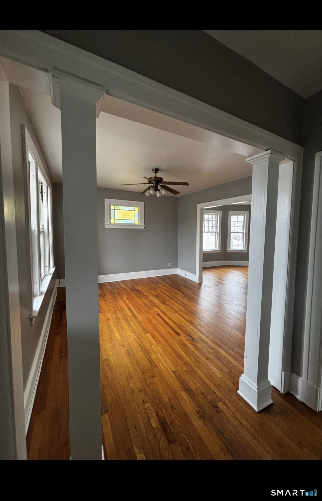 448 Hillside Avenue, Unit 2 Hartford, CT 06106 - Photo 2 of 11 a view of empty room with wooden floor and fan