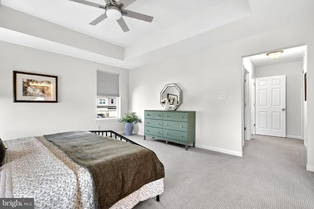 a view of a livingroom with wooden floor and staircase