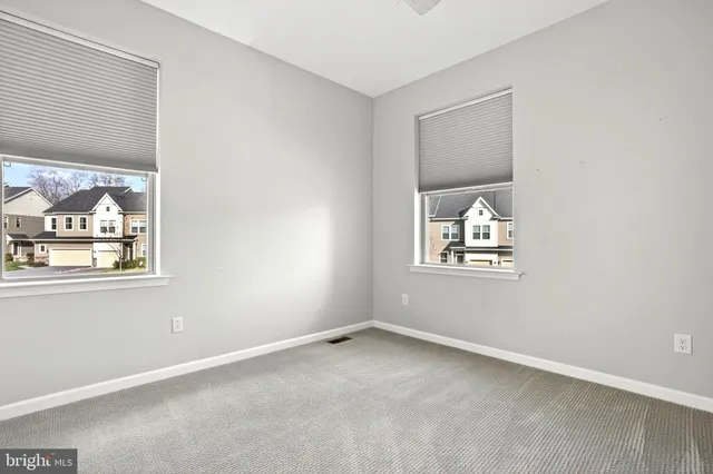 a view of a kitchen from a hallway