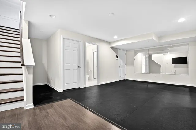 a bathroom with a shower and a sink