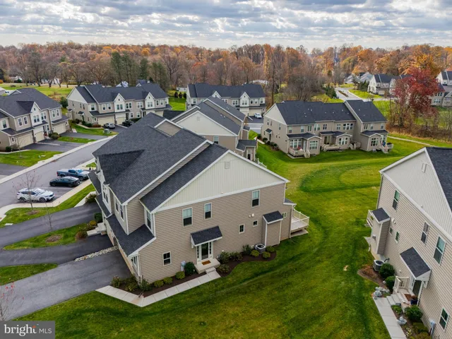 a view of a house with a big yard next to a yard