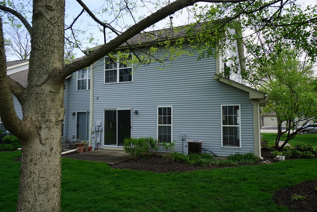1129 Coldspring Road Elgin, IL 60120 - Photo 18 of 18 a view of a house with a yard