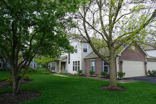 1129 Coldspring Road Elgin, IL 60120 - Photo 2 of 18 a front view of house with yard and green space