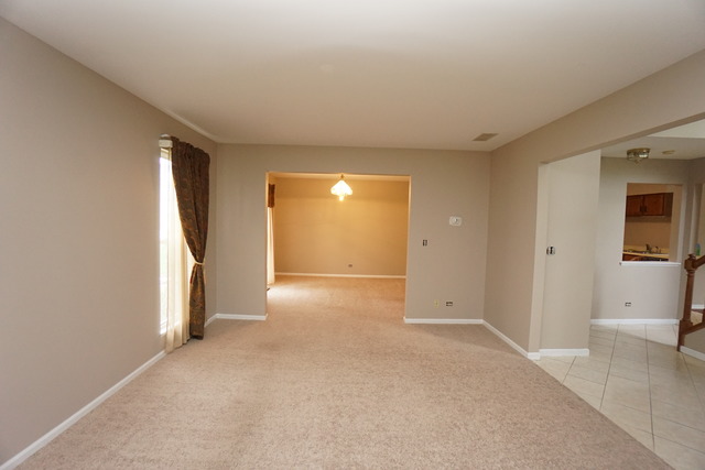 1129 Coldspring Road Elgin, IL 60120 - Photo 8 of 18 wooden floor and closet in a room