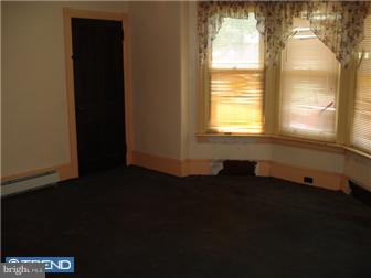536 New Street Spring City, PA 19475 - Photo 11 of 12 a view of an empty room with wooden floor and a window
