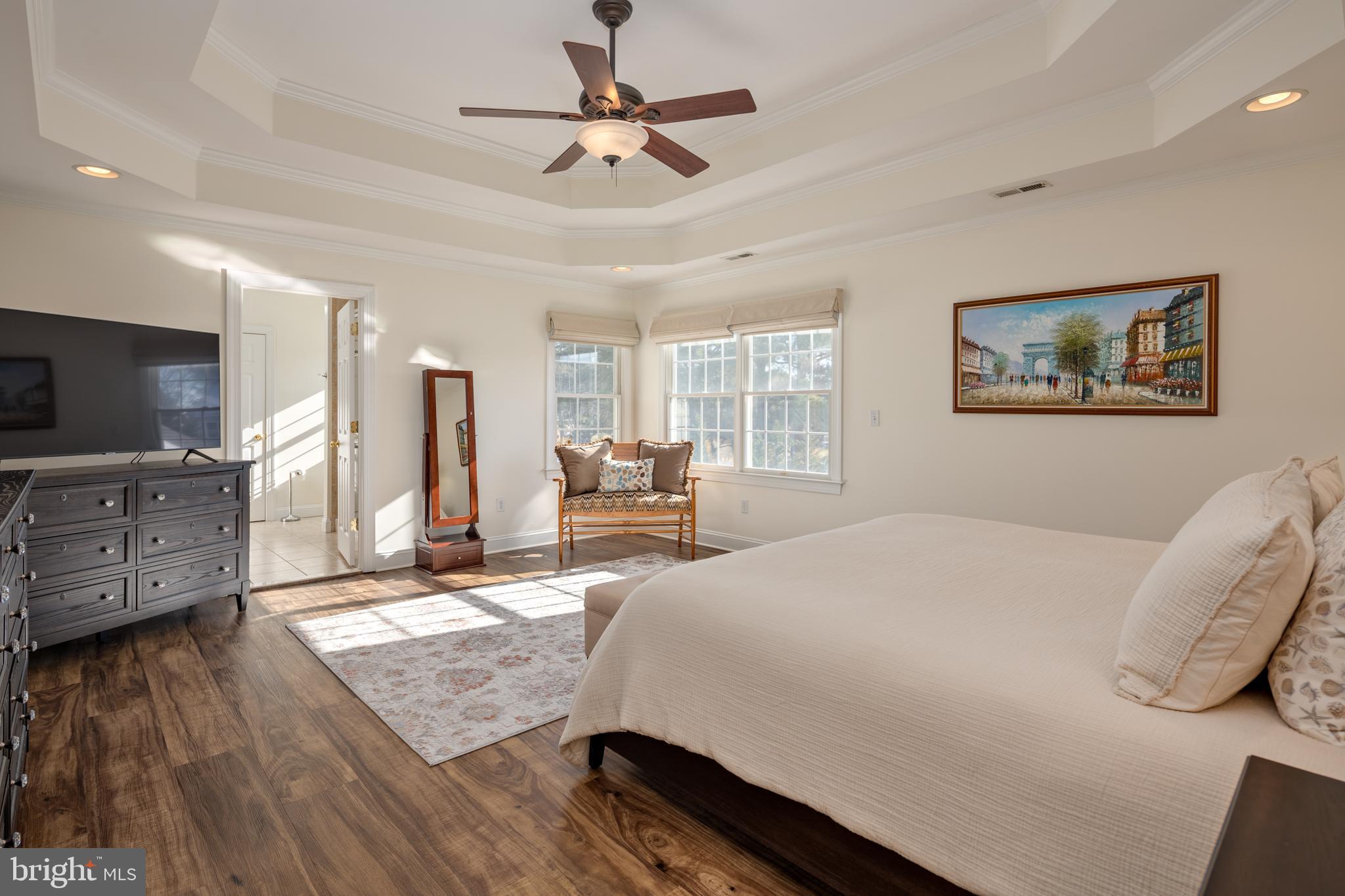 115 Cedar Road Chester, MD 21619 - Photo 30 of 71 a spacious bedroom with a bed a window and a flat screen television