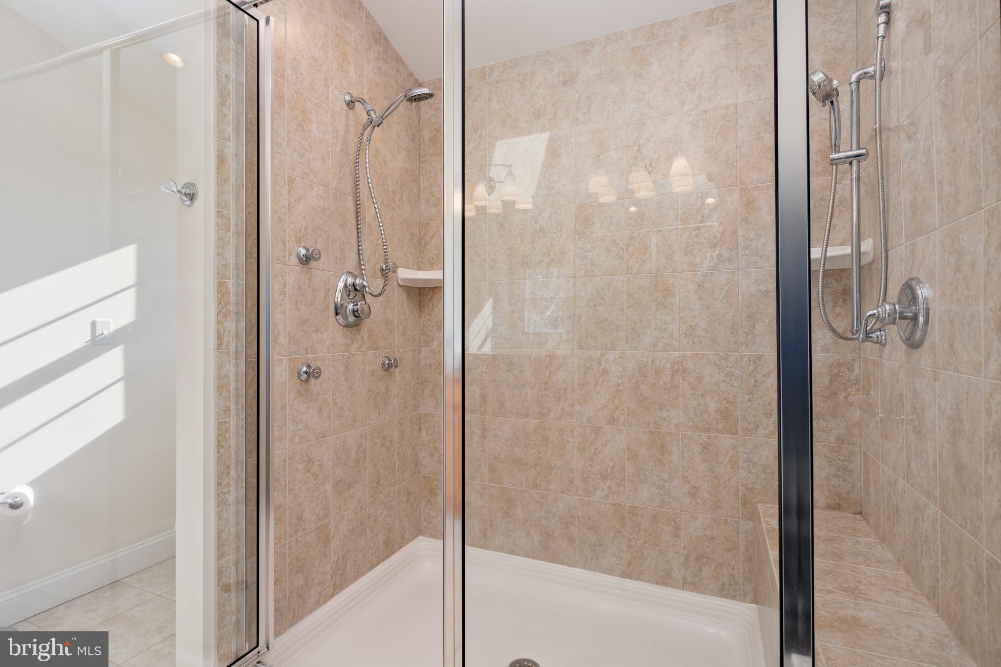 115 Cedar Road Chester, MD 21619 - Photo 34 of 71 a bathroom with a glass shower door