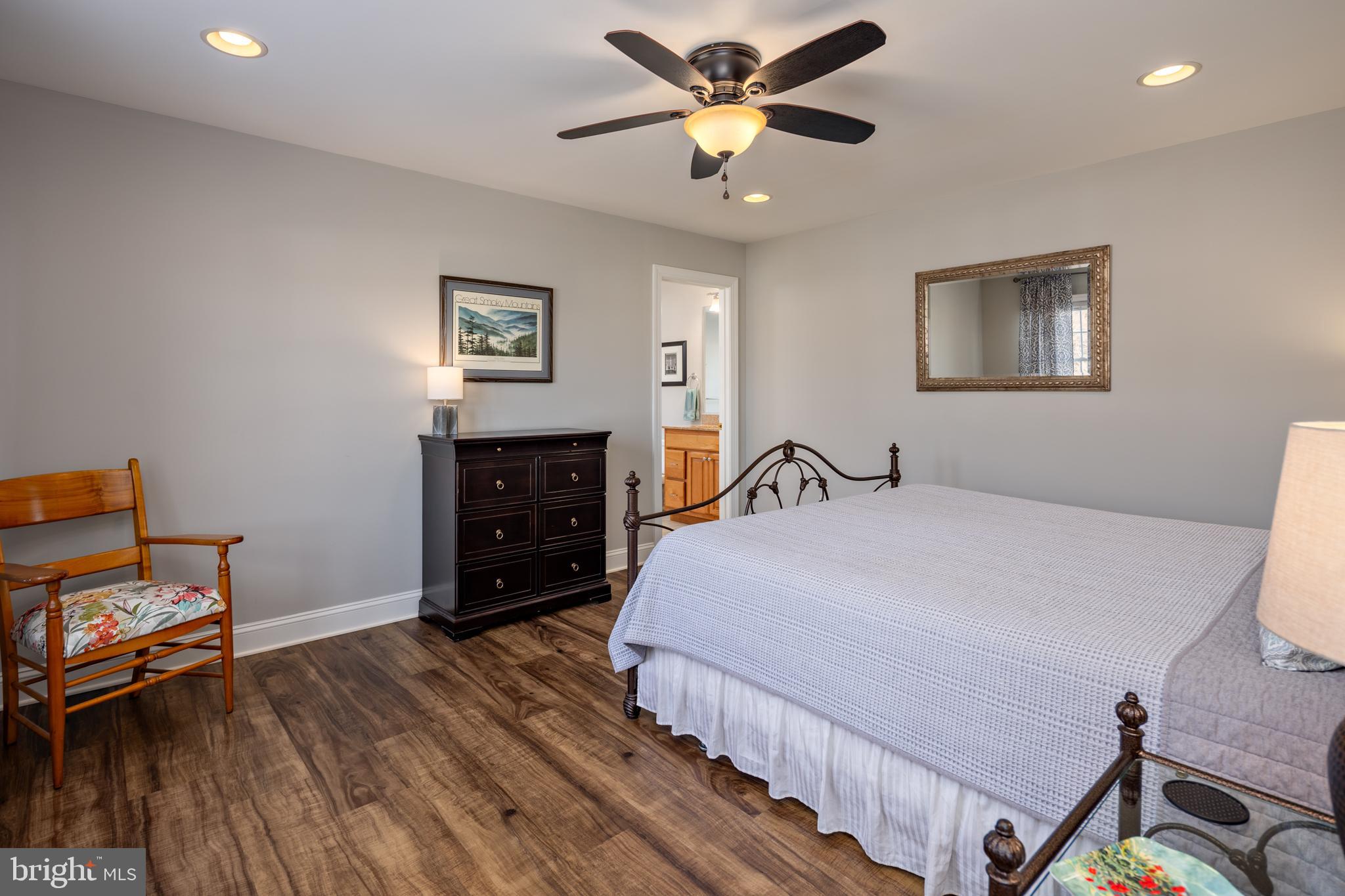 115 Cedar Road Chester, MD 21619 - Photo 39 of 71 a bedroom with a bed and wooden floor