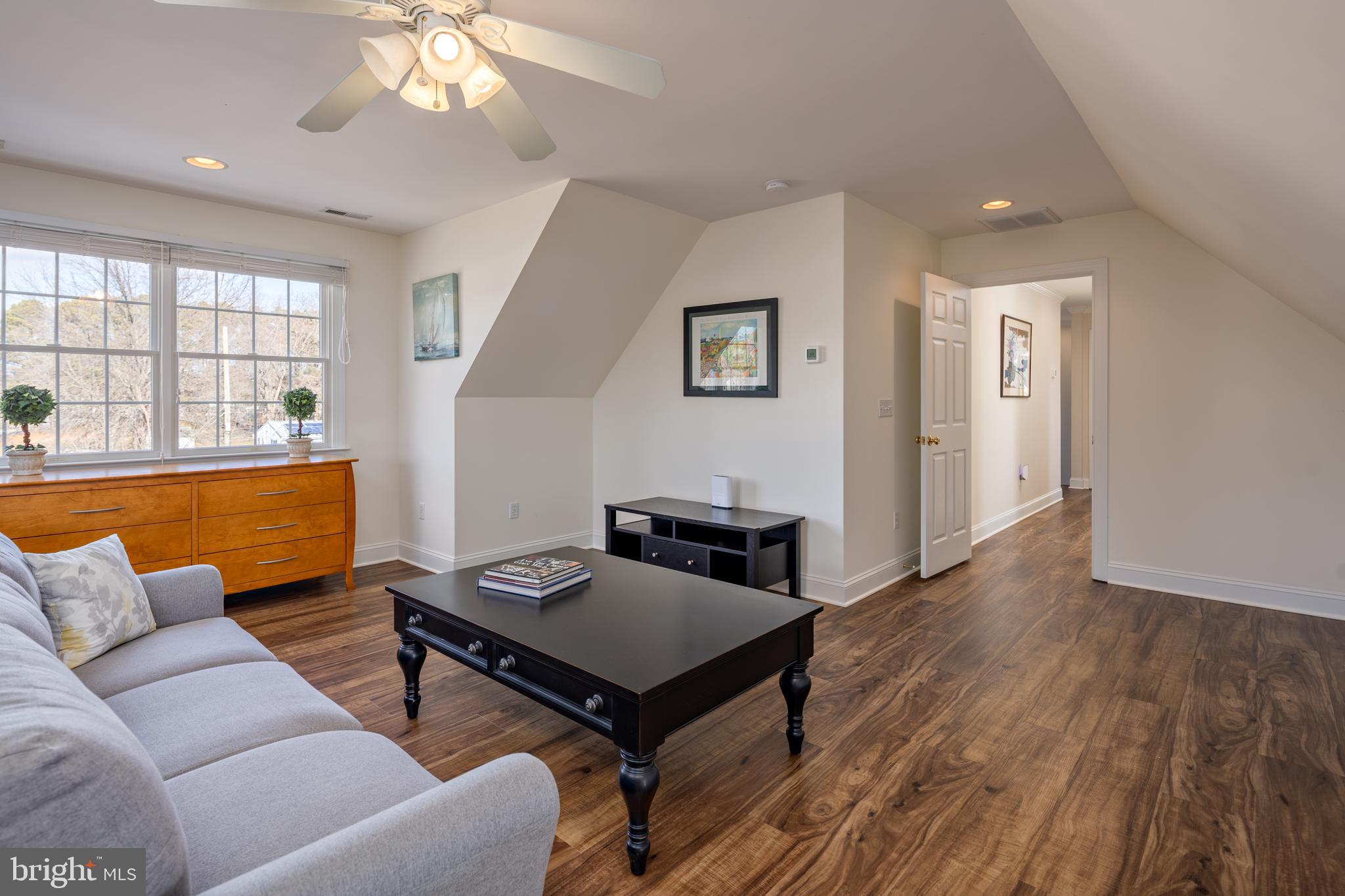 115 Cedar Road Chester, MD 21619 - Photo 50 of 71 a living room with furniture and a wooden floor