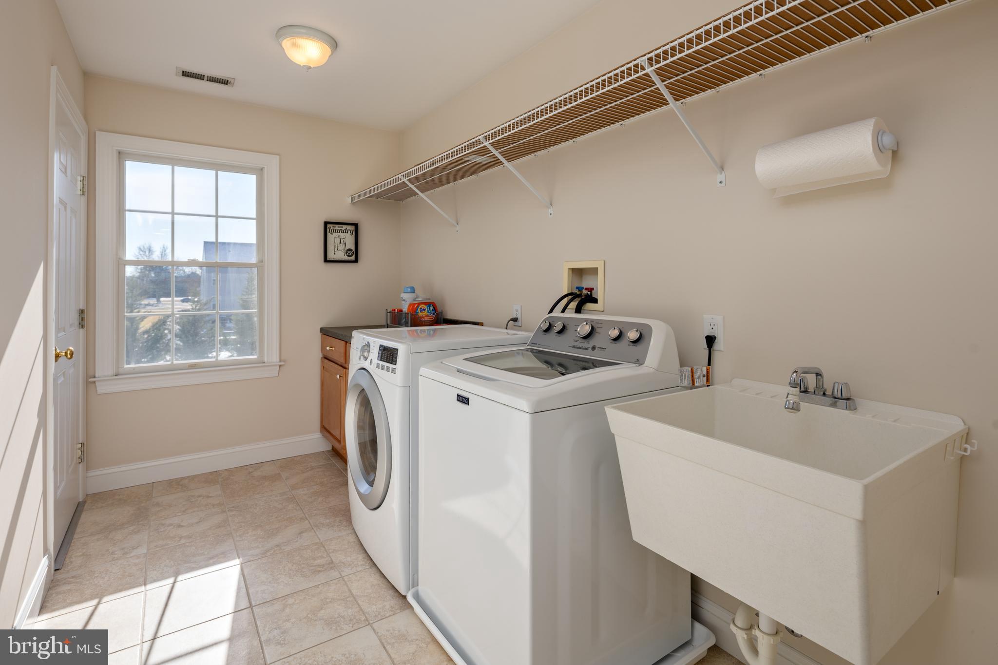 115 Cedar Road Chester, MD 21619 - Photo 52 of 71 a utility room with dryer and washer