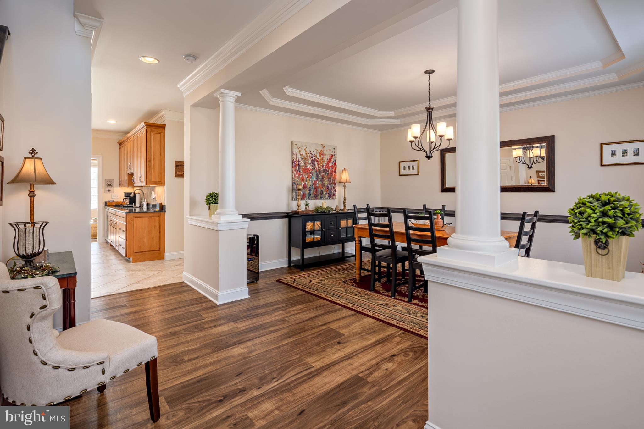 115 Cedar Road Chester, MD 21619 - Photo 6 of 71 a living room with furniture and a chandelier