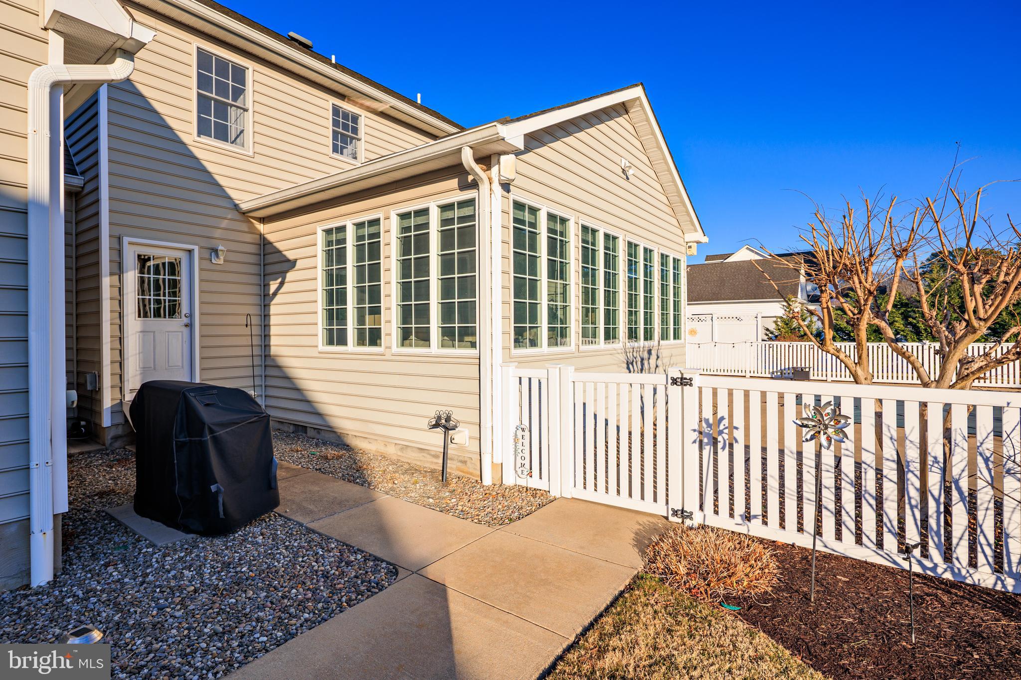 115 Cedar Road Chester, MD 21619 - Photo 61 of 71 a view of a house with a small yard and wooden fence