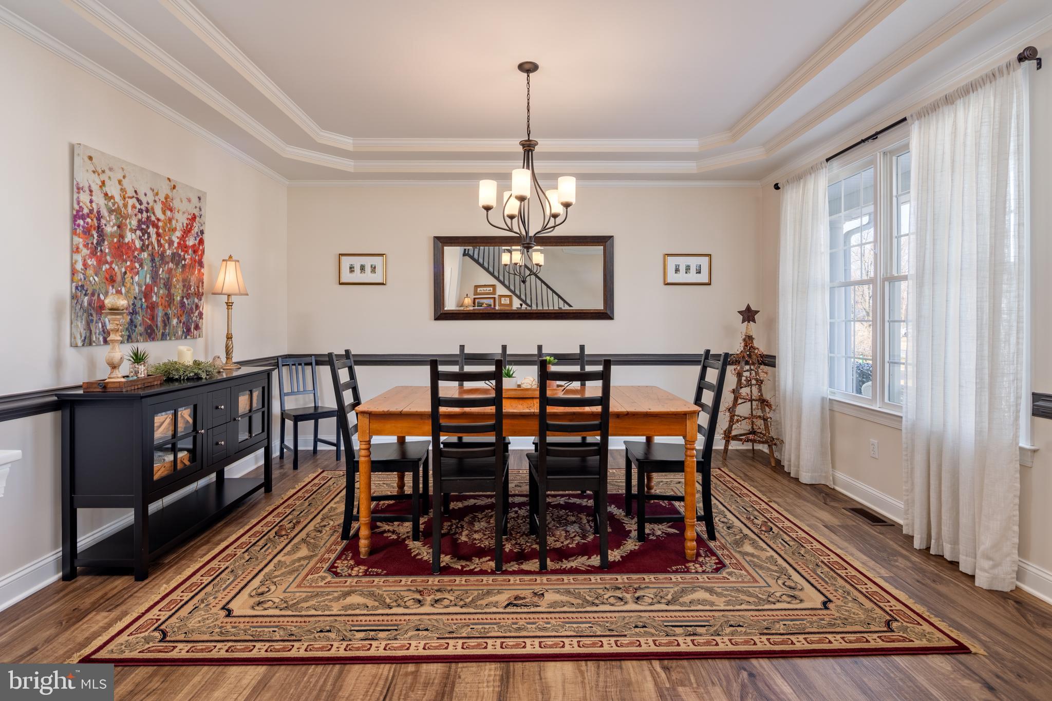 115 Cedar Road Chester, MD 21619 - Photo 7 of 71 a view of a dining room with furniture window and wooden floor