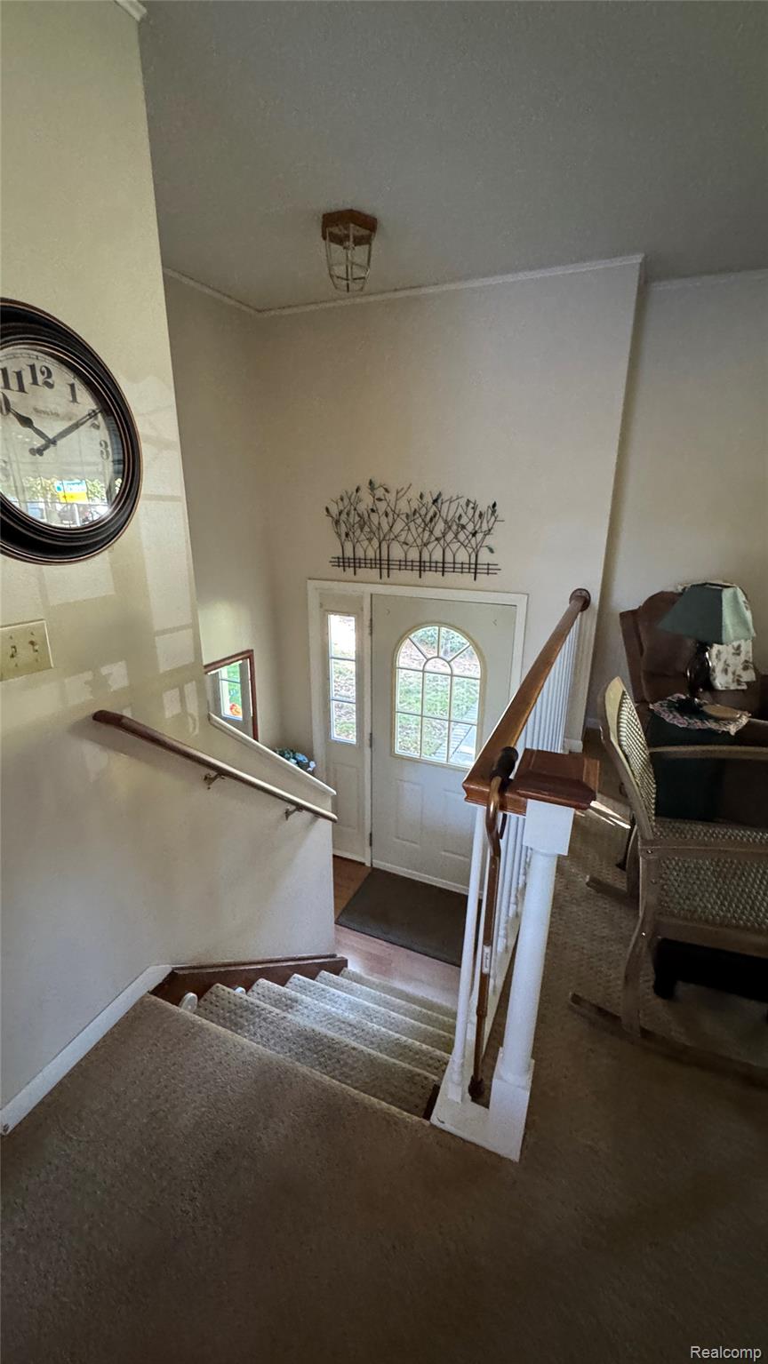 3828 Morgan Road Lake Orion, MI 48359 - Photo 31 of 39 Entryway with a white paneled door featuring an arched window and a sidelight