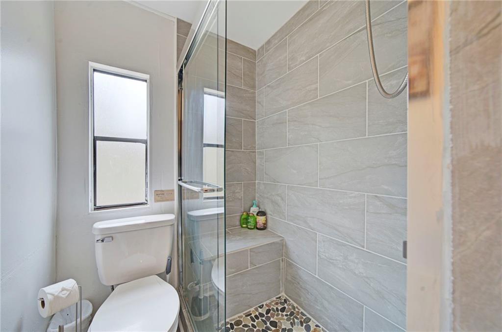 167 Jasmine Drive Ranger, GA 30734 - Photo 13 of 38 a bathroom with a toilet and a shower