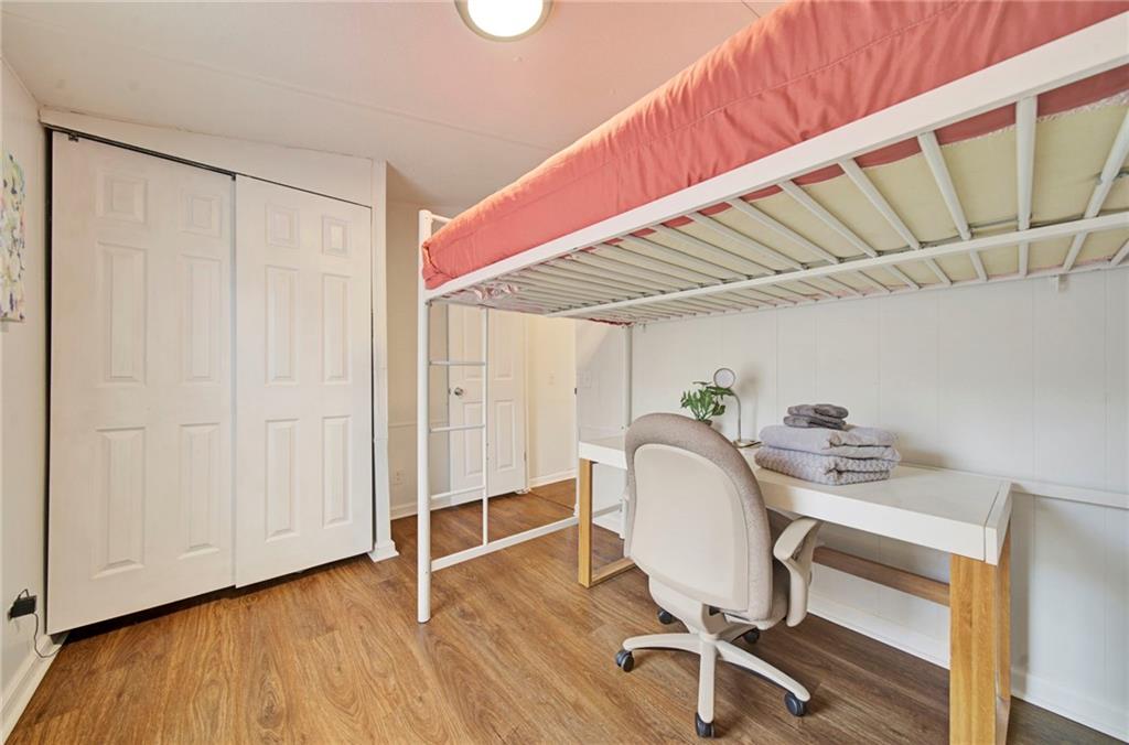 167 Jasmine Drive Ranger, GA 30734 - Photo 16 of 38 a workspace with wooden floor and furniture