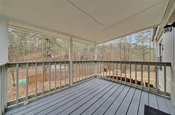 a view of a balcony with wooden floor