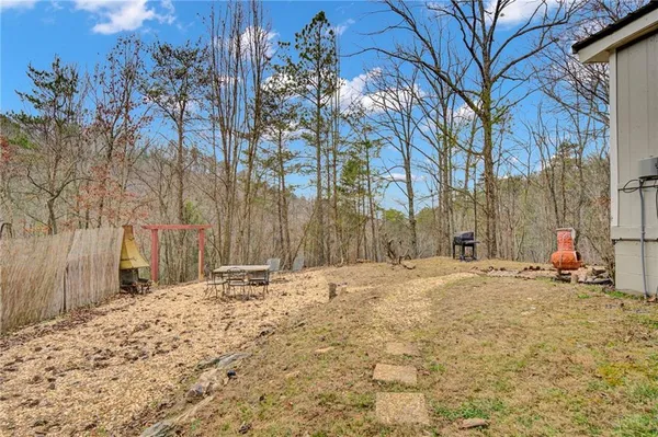a view of a backyard of the house
