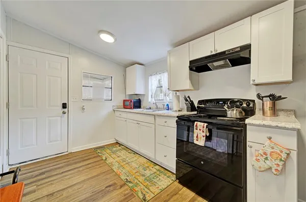 a kitchen with a stove and a sink