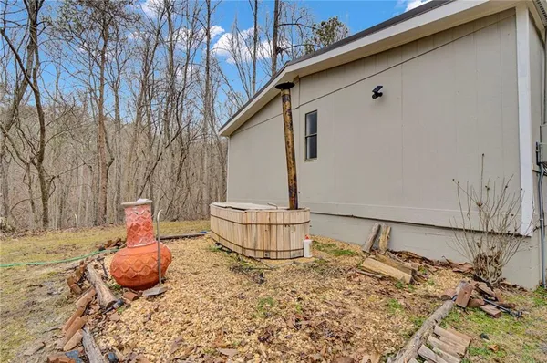 a backyard of a house with table and chairs