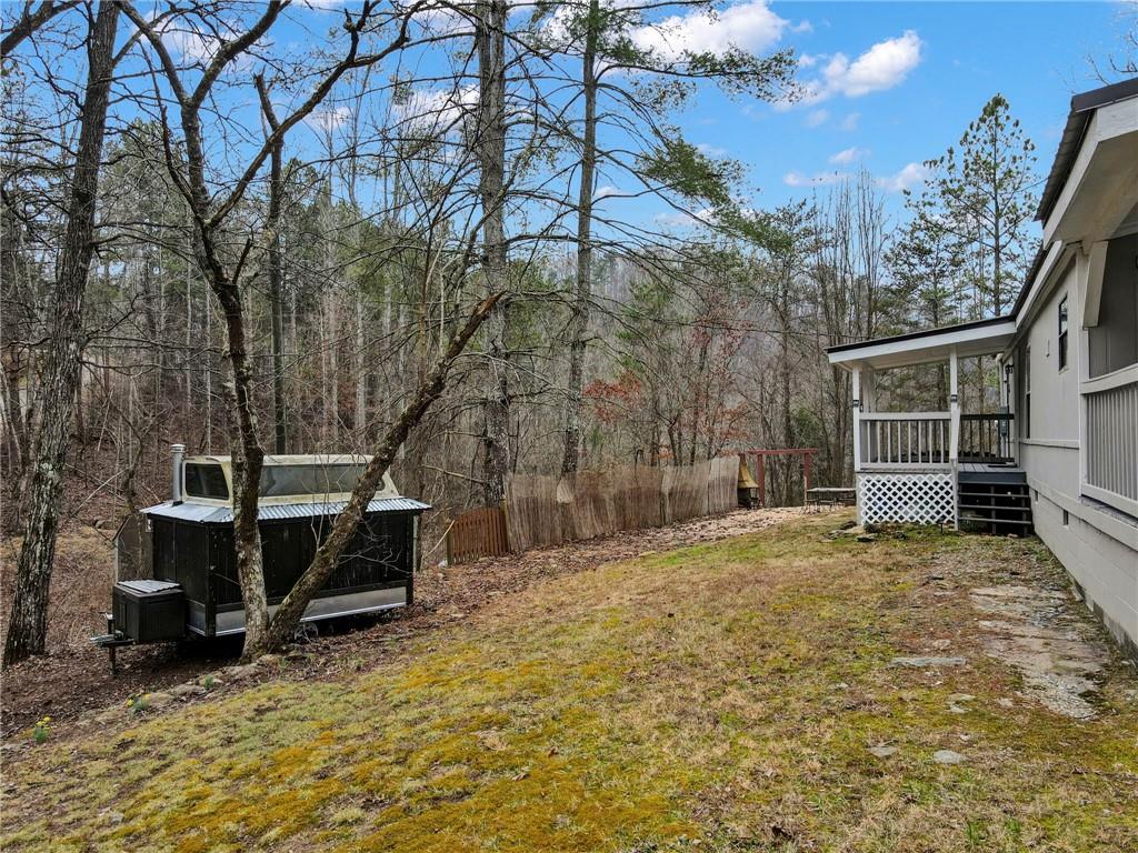 167 Jasmine Drive Ranger, GA 30734 - Photo 24 of 38 a view of a house with backyard and sitting area
