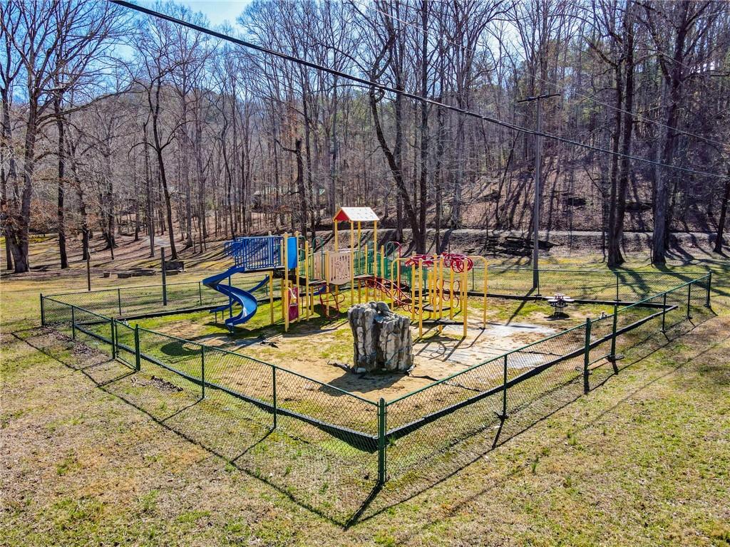 167 Jasmine Drive Ranger, GA 30734 - Photo 30 of 38 a view of a swimming pool with a bench and trees