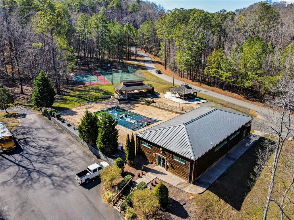 167 Jasmine Drive Ranger, GA 30734 - Photo 31 of 38 a view of a patio with table and chairs with wooden floor and fence