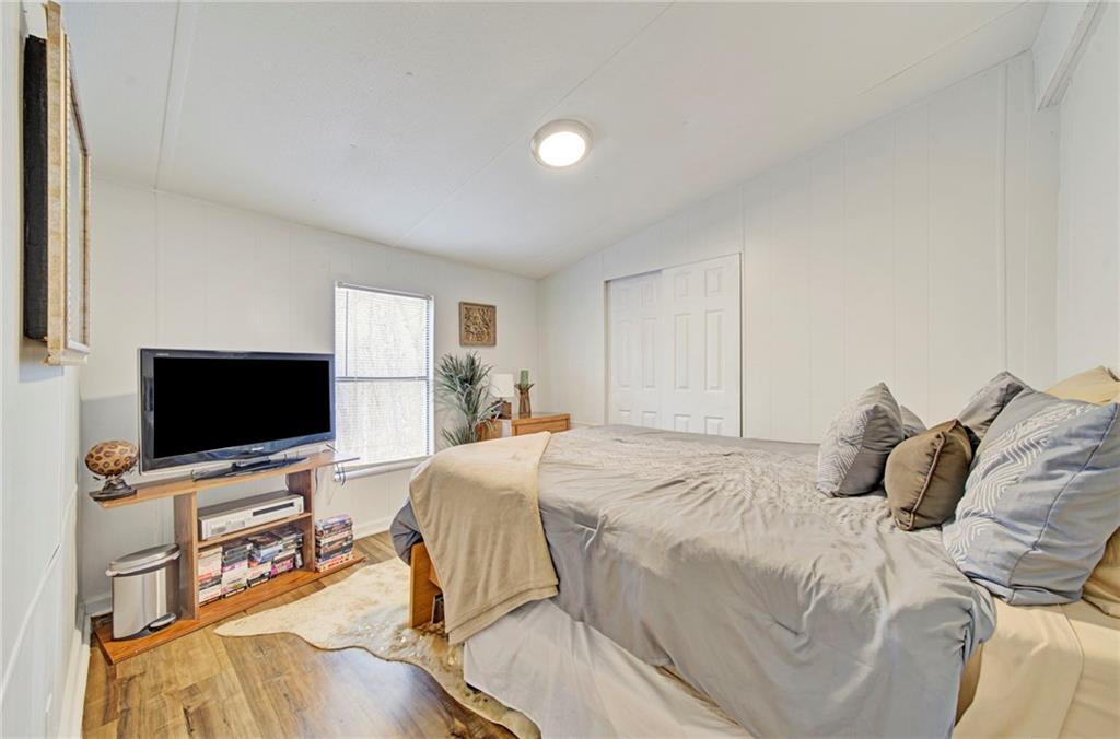 167 Jasmine Drive Ranger, GA 30734 - Photo 10 of 38 a bedroom with a bed and a flat screen tv