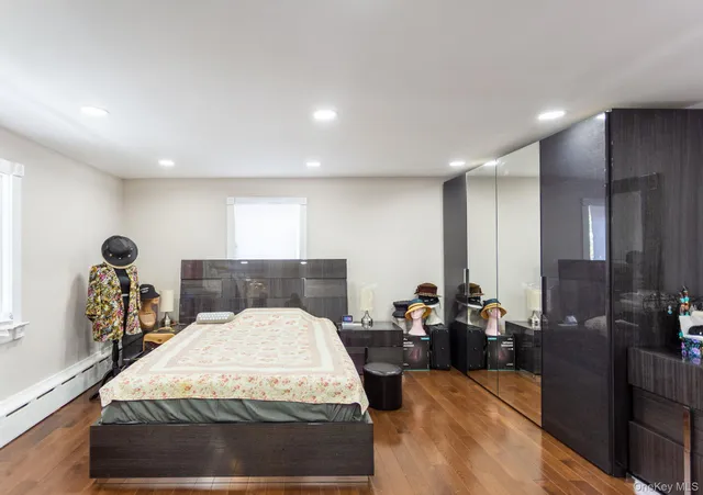 a bed room with a bed and a large mirror