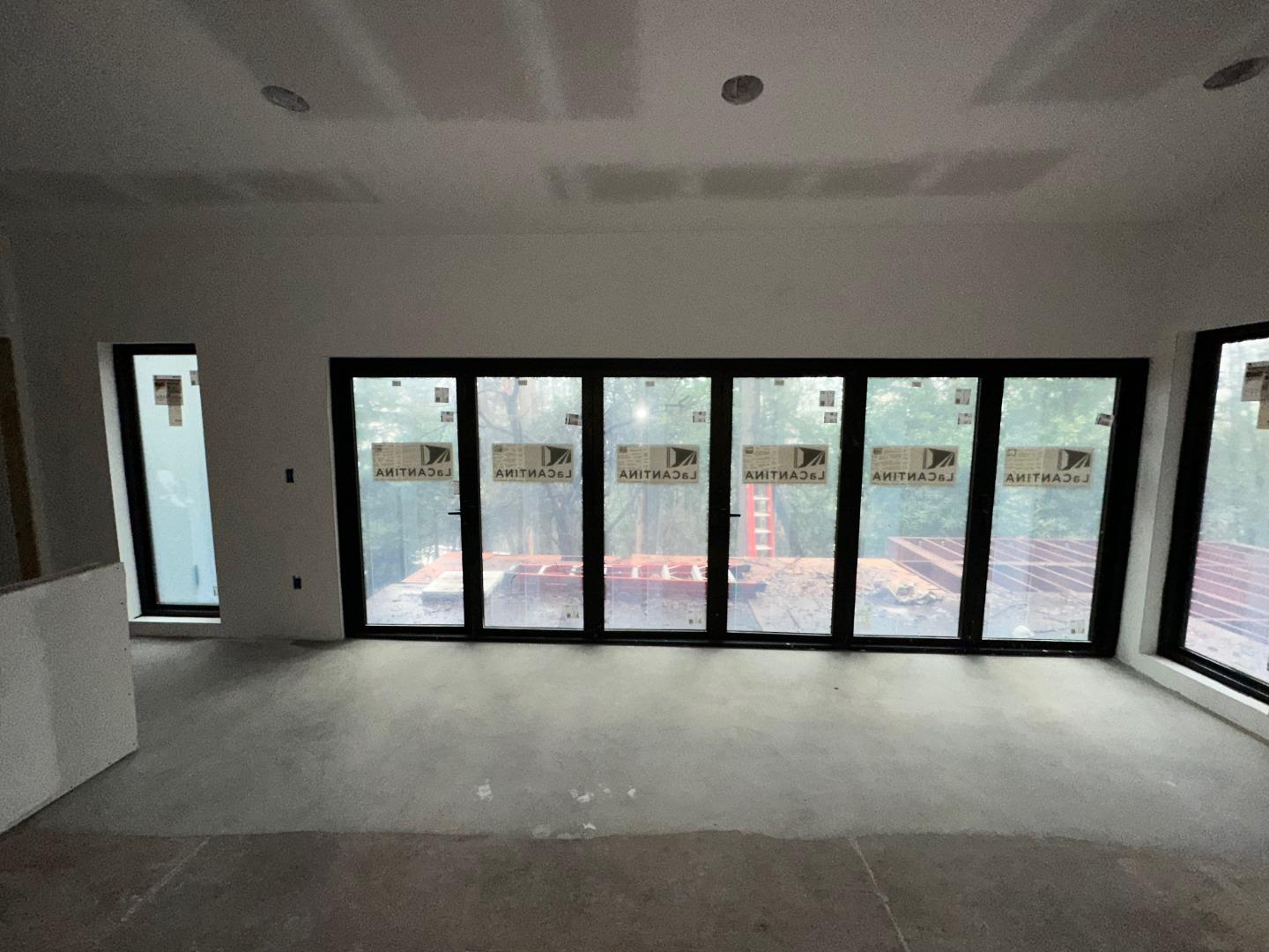 7032 Sayre Drive Oakland, CA 94611 - Photo 20 of 38 a view of an empty room with a large window