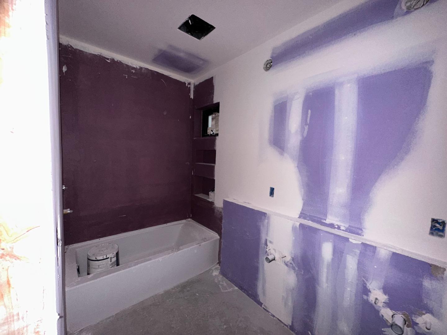 7032 Sayre Drive Oakland, CA 94611 - Photo 28 of 38 a bathroom with a bathtub and shower